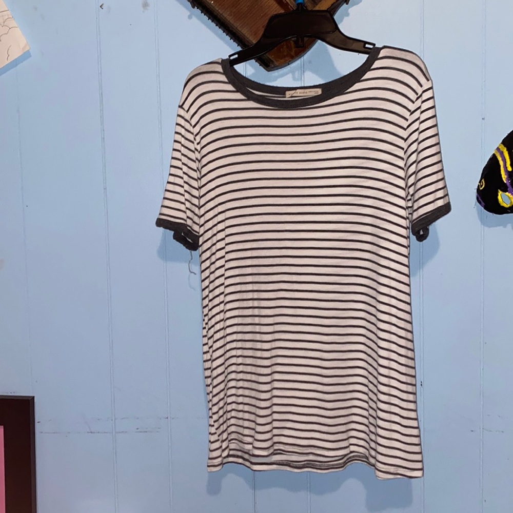 Shirt is soft and thin! Super cute to wear under any coat of choice.